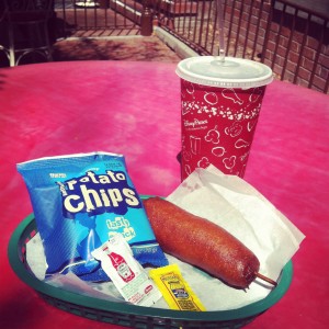 a hot dog and chips on a table