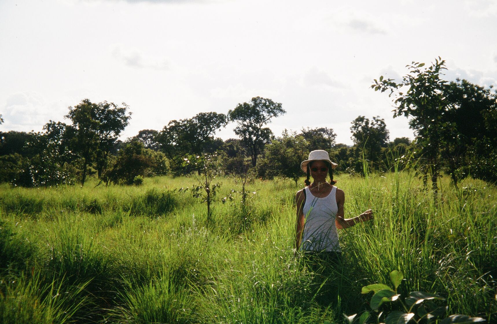 a woman in a field of tall grass