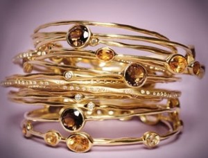 a stack of gold bracelets