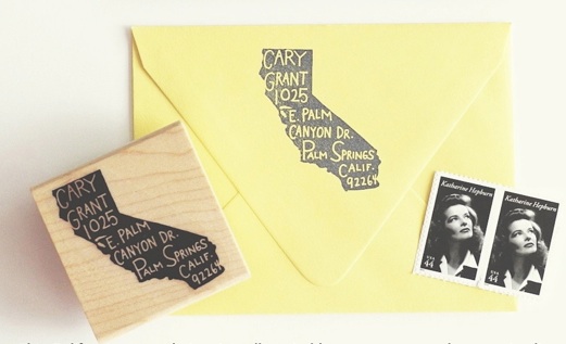 a yellow envelope with a stamp and a stamp
