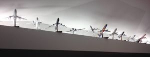 a group of model airplanes on a wall