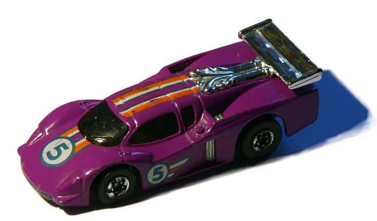 a purple toy car with a silver roof