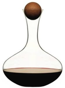 a glass decanter with a ball in the middle of it