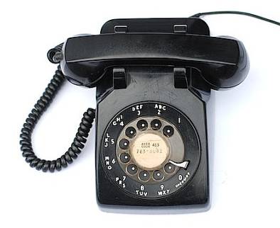 a close-up of a rotary telephone
