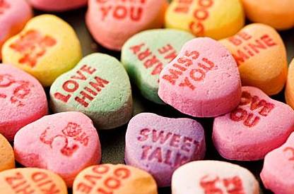 a group of candy hearts with text