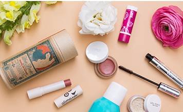 a group of makeup products and flowers