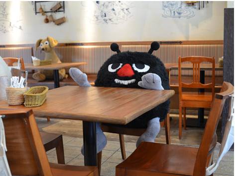 a stuffed toy sitting at a table