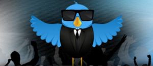 a blue bird wearing sunglasses and a suit