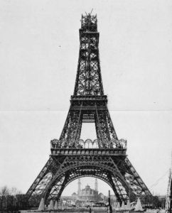 a black and white photo of the eiffel tower with Eiffel Tower in the background