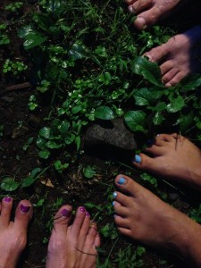 a group of feet with painted toenails