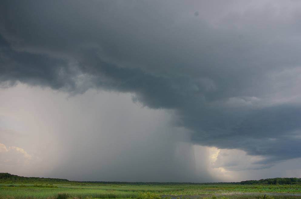 a large storm clouds over a field
