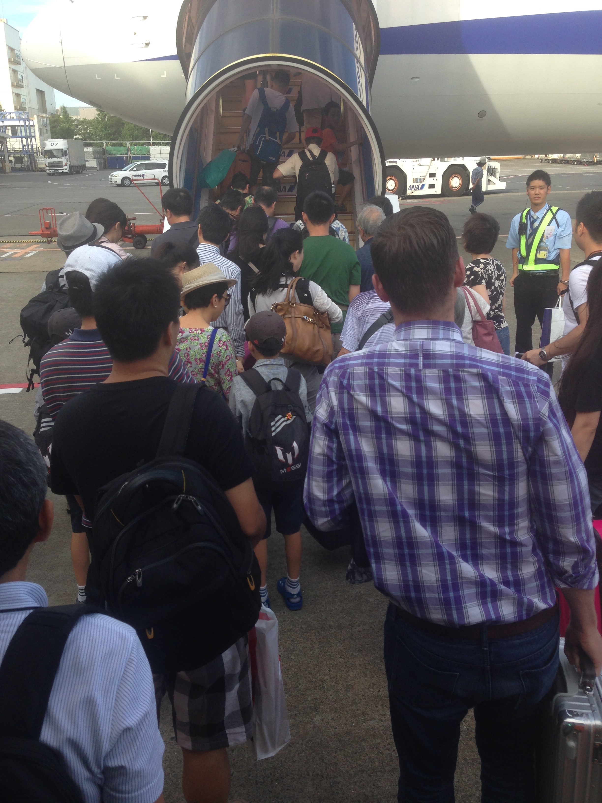 a group of people walking up to an airplane