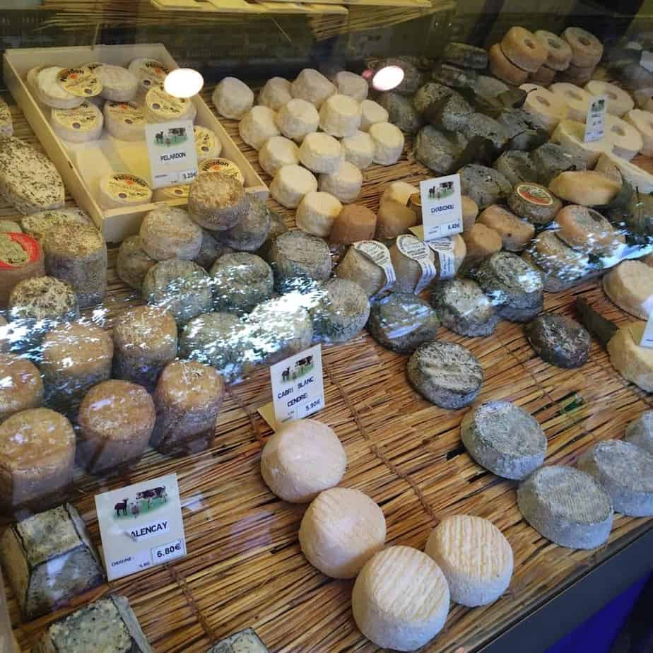 a display of cheeses on a table