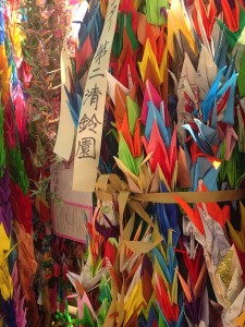 a group of colorful paper cranes