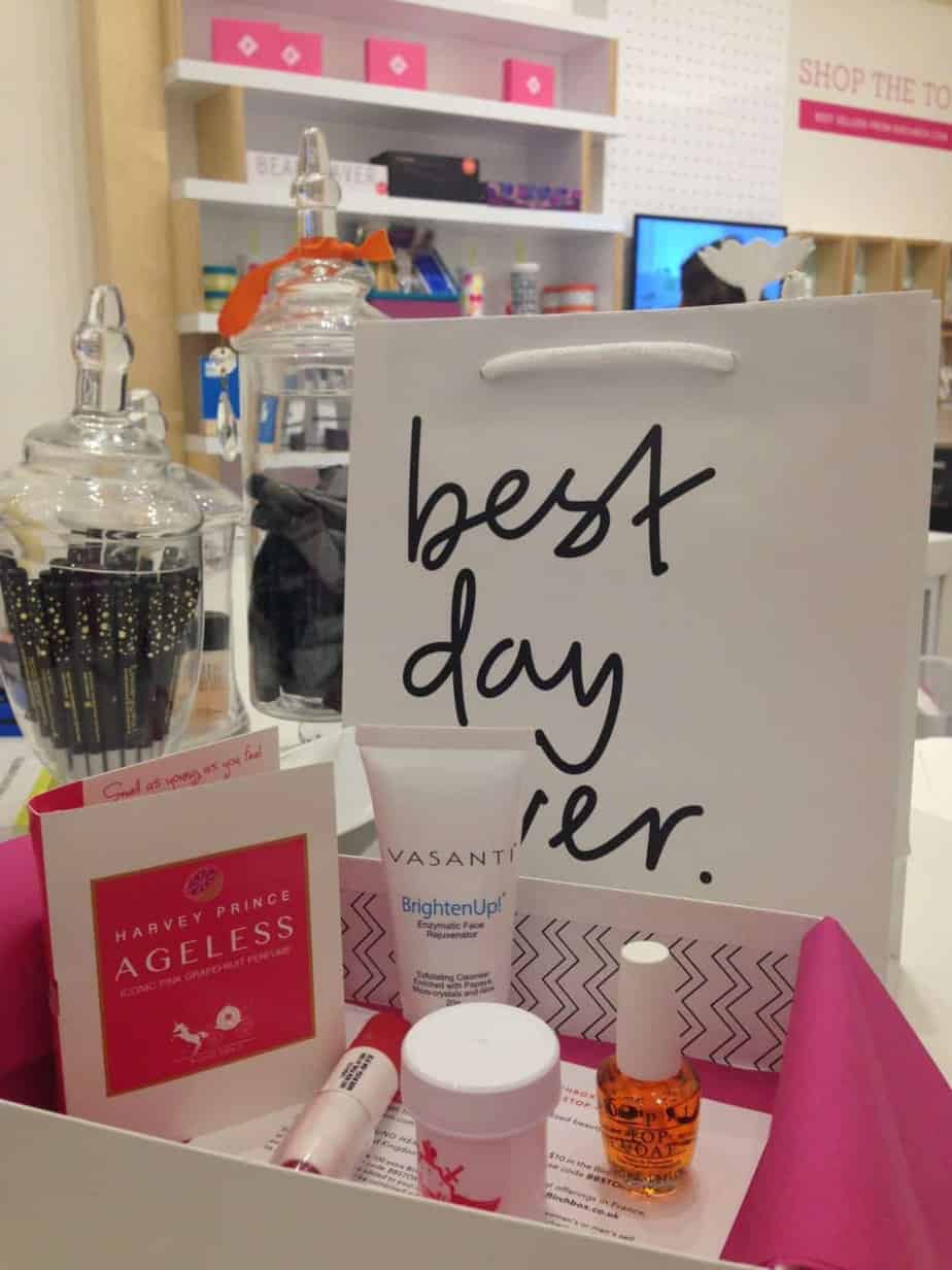 a bag with a sign and a group of beauty products